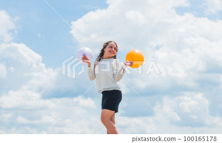 Play with air. Happiness is simple. Air balloons for party. Cheerful girl have fun. Summer holidays and vacation. Childhood happiness. Joyful teen celebrate. Happiness concept. Freedom concept 100165178