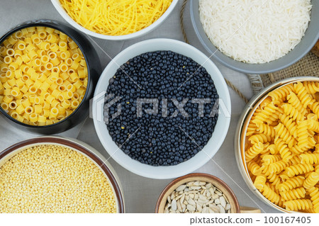 Lentil in bowl. Protein pulse that is dried and then soaked and cooked before eating. Vegetarian organic product. 100167405