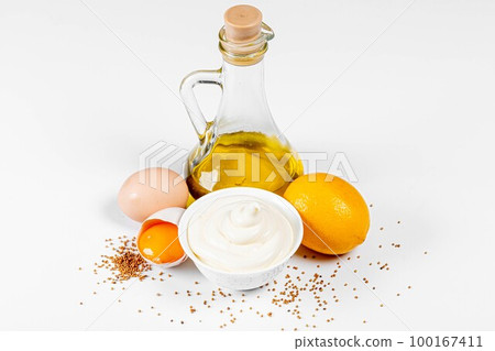 mayonnaise with ingredients on white background 100167411