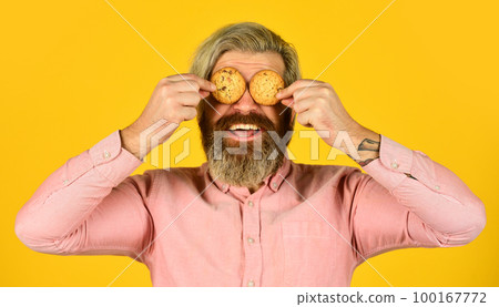 bakery shop advertisement. man on dieting. bearded hipster hold biscuit. full of calorie. concept of harmful food. pastry and dessert. Christmas bakery gingerbread cookie. for santa bakery shop advertisement. man on dieting. bearded hipster hold biscuit. full of calorie. concept of harmful food. pastry and dessert. Christmas bakery gingerbread cookie. for santa 100167772