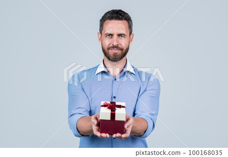 Happy birthday to you. Handsome man give birthday present. Anniversary celebration. Holiday greetings. Gift shop. Occasion makes special 100168035