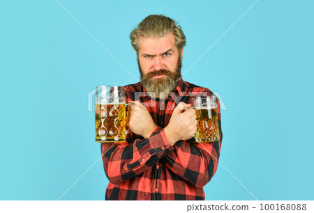 Alcoholic. Thirsty man drinking beer in pub bar. Hipster drink beer. Mature bearded guy hold beer glass. Cheers toast. True sensation. Holiday celebration. Bachelor day. Improve mood. Get drunk Alcoholic. Thirsty man drinking beer in pub bar. Hipster drink beer. Mature bearded guy hold beer glass. Cheers toast. True sensation. Holiday celebration. Bachelor day. Improve mood. Get drunk 100168088