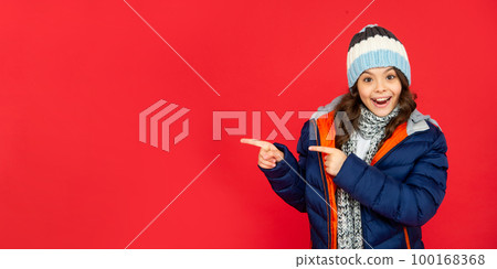 portrait of child wearing warm clothes with scarf. express positive emotion. winter fashion. portrait of child wearing warm clothes with scarf. express positive emotion. winter fashion. 100168368