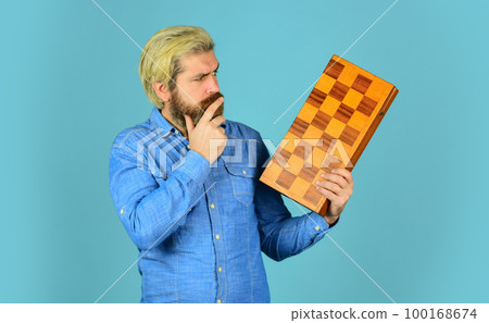 Chess figures. Intellectual games. Intelligent bearded hipster. Cognitive skills. Game strategy concept. Chess lesson. Teacher chess competition. Board game. Man playing chess. Hobby and leisure Chess figures. Intellectual games. Intelligent bearded hipster. Cognitive skills. Game strategy concept. Chess lesson. Teacher chess competition. Board game. Man playing chess. Hobby and leisure 100168674