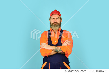 Builder or plasterer. mature repairman in uniform. foreman wear boilersuit. Laborer man in working clothes. builder in working overalls. Engineer and industrial building. Repair advertisement Builder or plasterer. mature repairman in uniform. foreman wear boilersuit. Laborer man in working clothes. builder in working overalls. Engineer and industrial building. Repair advertisement 100168678