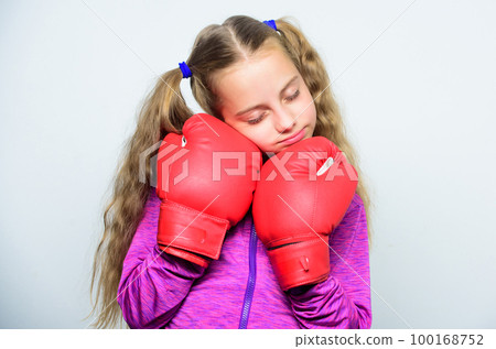 Girl cute child with red gloves posing on white background. Sport upbringing. Upbringing for leader. Strong child boxing. Sport and health concept. Boxing sport for female. Skill of successful leader Girl cute child with red gloves posing on white background. Sport upbringing. Upbringing for leader. Strong child boxing. Sport and health concept. Boxing sport for female. Skill of successful leader 100168752