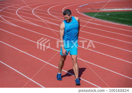 guy knead a joint because of sport trauma after workout, sport injury 100168824