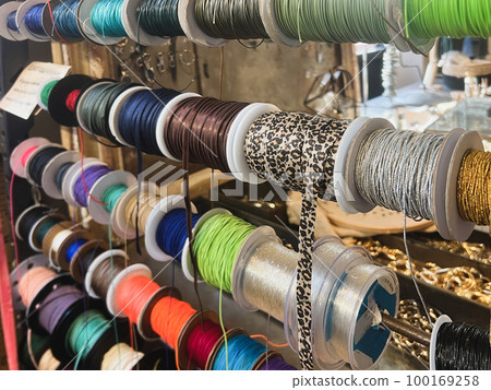 Reels of ribbons hanging in the store Reels of ribbons hanging in the store 100169258