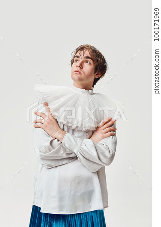 Thoughtful look. Fashion portrait of stylish high fashionable boy posing isolated over grey background. Concept of modern fashion, uniqueness, ad 100171969
