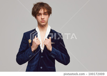 Fashion portrait of stylish high fashionable boy posing isolated over grey background. Concept of modern fashion, uniqueness, ad 100172009