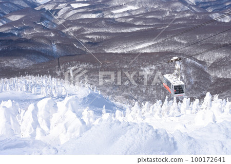 A gondola that runs through frost-covered trees A gondola that runs through frost-covered trees 100172641