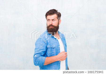 Denim fashion trends. Personality and character. Charisma concept. Bearded well groomed hipster. Good looking guy wear fashion clothes. Barbershop fashion. Charismatic barber with beard and mustache Denim fashion trends. Personality and character. Charisma concept. Bearded well groomed hipster. Good looking guy wear fashion clothes. Barbershop fashion. Charismatic barber with beard and mustache 100175941