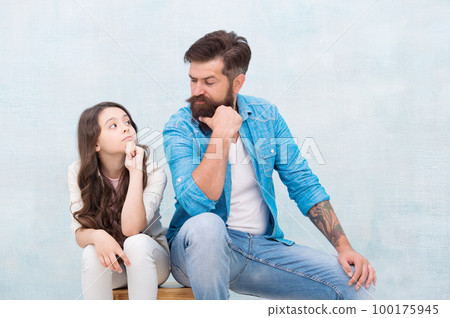 Love makes you family. Little girl and bearded man look at each other. Loving relationship between father and small daughter. Feeling of love and security. Trust and care. Family relationship 100175945
