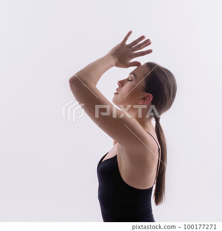 Athletic woman in swimsuit, doing yoga, push-ups, beautiful female exercising at studio Athletic woman in swimsuit, doing yoga, push-ups, beautiful female exercising at studio 100177271