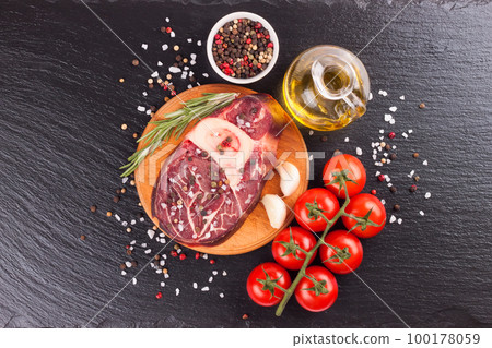 meat steak and cooking ingredients on black background meat steak and cooking ingredients on black background 100178059