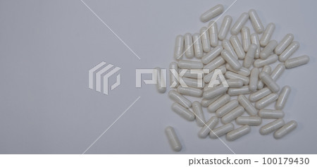 medical pills and capsule spilling from bottle on the white background medical pills and capsule spilling from bottle on the white background 100179430