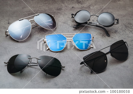 Assortment of different fashion sunglasses in optical shop Assortment of different fashion sunglasses in optical shop 100180038