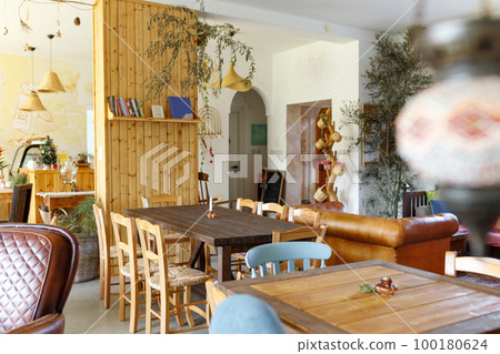Scandinavian interior style,cozy cafe place, natural light from window.Zero waste home concept.Wooden furniture Scandinavian interior style,cozy cafe place, natural light from window.Zero waste home concept.Wooden furniture 100180624