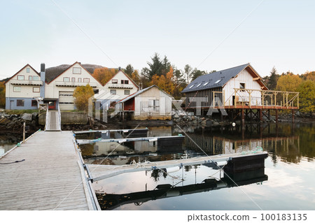 Norwegian fishing village, coastal view with wooden houses Norwegian fishing village, coastal view with wooden houses 100183135