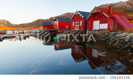Norwegian landscape photo with traditional old red wooden barns 100183136