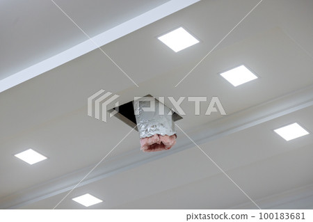 As part of renovation process ventilation and air conditioning system is being installed on ceiling of house which has already been painted 100183681