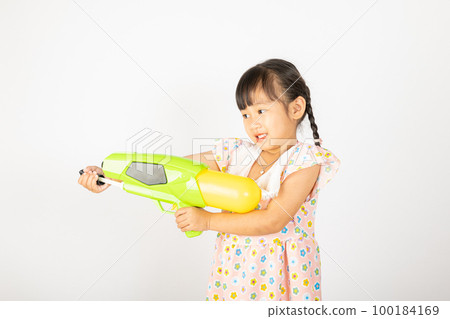 Happy Songkran Day, Asian little girl holding plastic water gun, Thai child funny hold toy water pistol and smile, isolated on white background, Thailand Songkran festival national culture concept 100184169