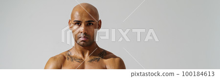 Portrait of attractive sporty man with muscled naked body on white studio background 100184613