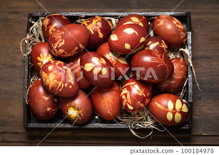 Traditional easter eggs dyed in onion peel 100184978