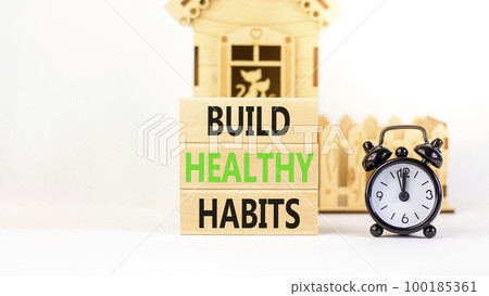 Motivation and Build healthy habits symbol. Concept words Build healthy habits on wooden block on a beautiful white table white background. Business build healthy habits concept. Copy space. Motivation and Build healthy habits symbol. Concept words Build healthy habits on wooden block on a beautiful white table white background. Business build healthy habits concept. Copy space. 100185361