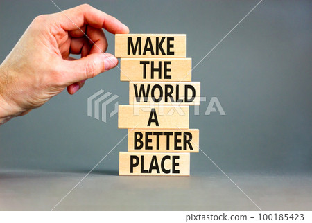 Make a better world symbol. Concept words Make the world a better place on wooden blocks. Beautiful grey table grey background. Businessman hand. Business make a better world concept. Copy space. Make a better world symbol. Concept words Make the world a better place on wooden blocks. Beautiful grey table grey background. Businessman hand. Business make a better world concept. Copy space. 100185423