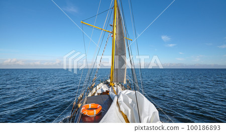 Sailing old schooner on a beautiful sunny day. 100186893