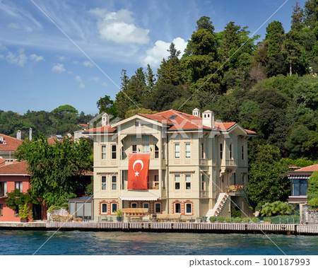 Green mountains of the Asian side of Bosphorus strait, with traditional house and dense trees in a summer day Green mountains of the Asian side of Bosphorus strait, with traditional house and dense trees in a summer day 100187993