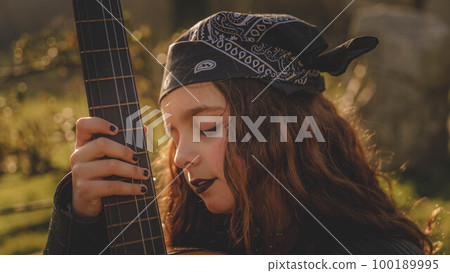teenage woman with guitar teenage woman with guitar 100189995