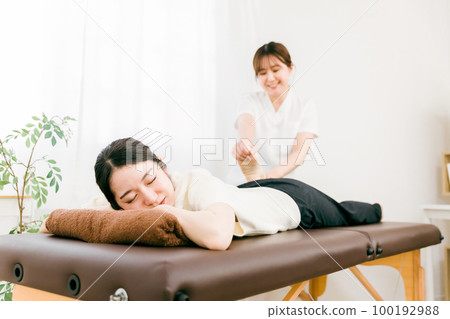 A woman who is a physiotherapist, masseuse, and therapist who corrects the pelvis at an osteopathic clinic A woman who is a physiotherapist, masseuse, and therapist who corrects the pelvis at an osteopathic clinic 100192988