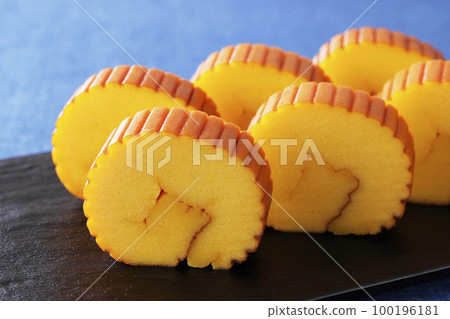 Datemaki tamago placed on a blue background cloth Datemaki tamago placed on a blue background cloth 100196181