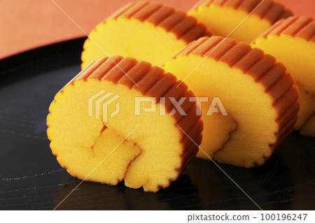 Datemaki tamago on a black tray 100196247