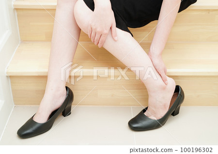Asian business woman pain ankle, foot with leg cramp and fall down the stairs because slippery surfaces in office. Asian business woman pain ankle, foot with leg cramp and fall down the stairs because slippery surfaces in office. 100196302