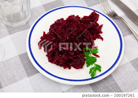 Salad of grated baked beetroot on plate with fresh parsley Salad of grated baked beetroot on plate with fresh parsley 100197261