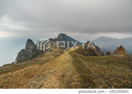 Landscape of Karadag Reserve in spring. View of rocks of ridge Karagach. Crimea Landscape of Karadag Reserve in spring. View of rocks of ridge Karagach. Crimea 100200891