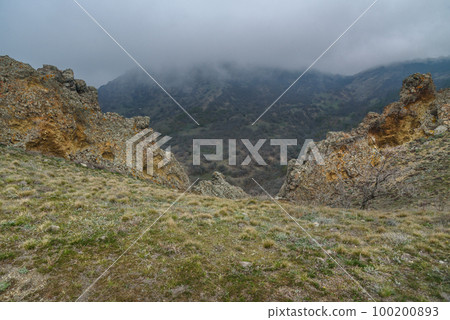 Landscape of Karadag Reserve in spring. View of rocks of ridge Karagach. Crimea 100200893