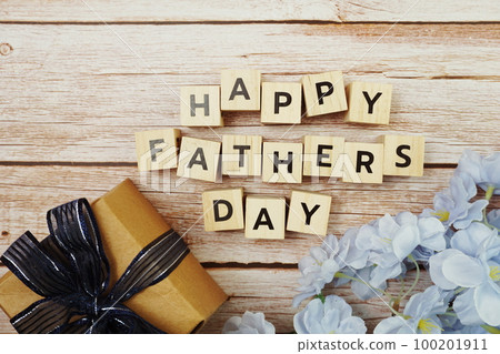 Happy Valentines day alphabet letter with gift present and flower decoration on wooden background 100201911