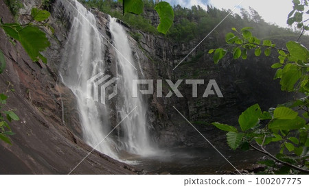 Waterfall in mountains. Outdoor nature in Norway 100207775