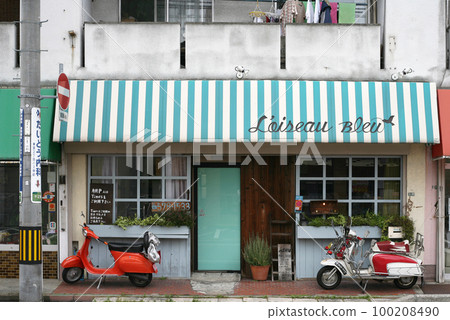 Quaint buildings and scooters 100208490