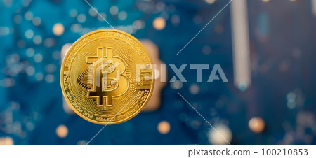 Cryptocurrency concept , Golden bitcoin on winners cup background mainboard , The future of money. Computational equipment. Cryptocurrency concept , Golden bitcoin on winners cup background mainboard , The future of money. Computational equipment. 100210853