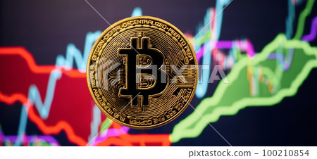 Bitcoin coins with global trading exchange market price chart in the background. Bitcoin coins with global trading exchange market price chart in the background. 100210854