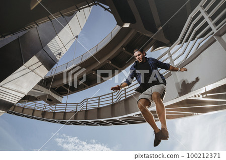 Parkour athlete flying from high attitude. Parkour athlete flying from high attitude. 100212371