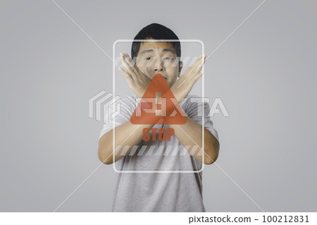 Young man showing stop gesture with stop sign virtual screen. 100212831