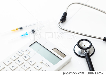 Stethoscope and calculator white background 100214257