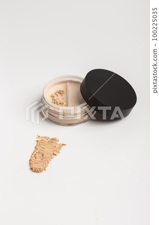 Mineral makeup powder twist seal sifter isolated on white background. Light beige foundation powder. Skin tone face cosmetic product sample 100225035