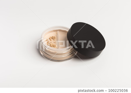 Mineral makeup powder twist seal sifter isolated on white background. Light beige foundation powder. Skin tone face cosmetic product sample Mineral makeup powder twist seal sifter isolated on white background. Light beige foundation powder. Skin tone face cosmetic product sample 100225036